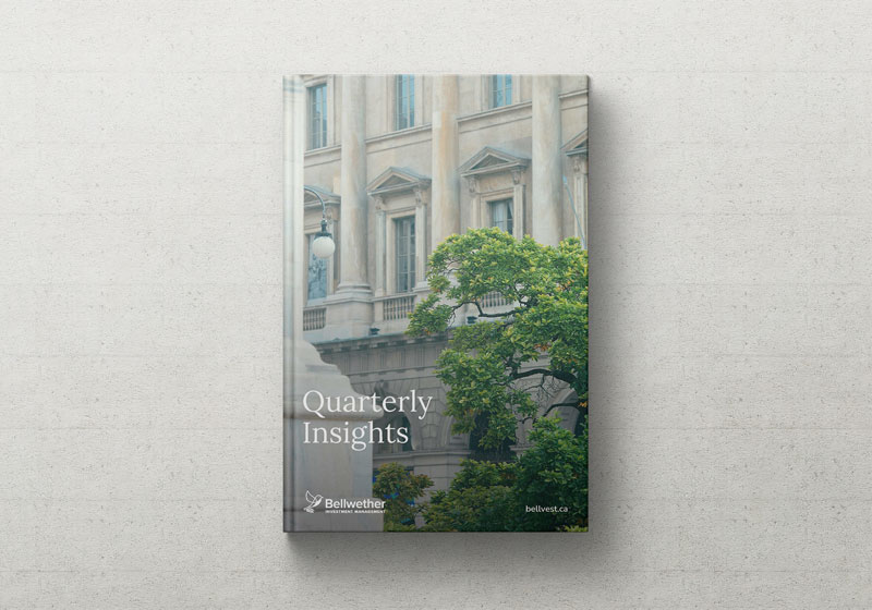 A hardcover book titled Quarterly Insights, featuring the latest insights, with a cover image of a tree and a classical building facade, placed on a light-colored surface.