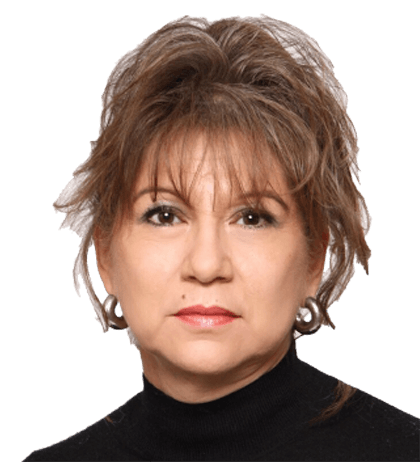 Darlene Gayle Ferstl, a woman with short, layered brown hair, wears hoop earrings and a black turtleneck, facing forward with a neutral expression.