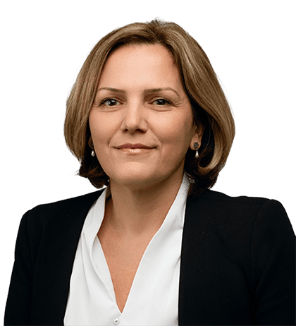Jelena Petranovic, a woman with short brown hair, wears a black blazer and white blouse, facing forward with a neutral expression against a plain background.