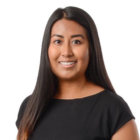 A woman with long straight hair and a black top smiles at the camera against a plain white background.