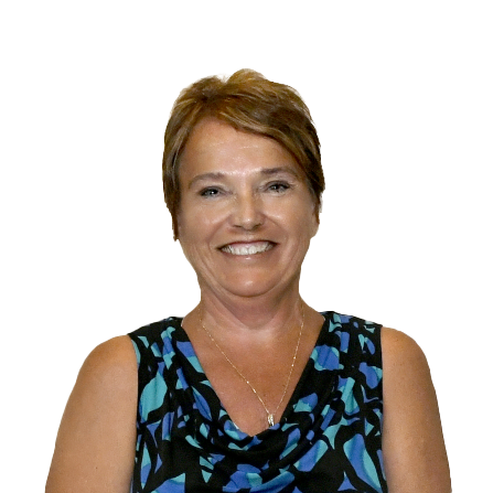 Connie Ferguson, with short light brown hair, smiles at the camera. She is wearing a sleeveless patterned top and a necklace, pictured against a white background.